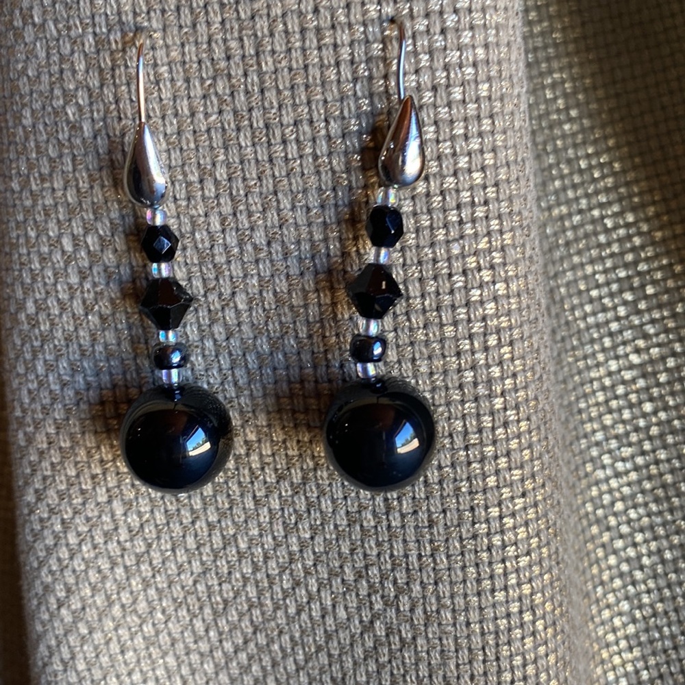 Black hanging earrings with silver detail